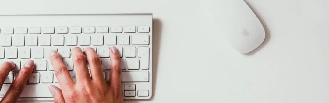 An image of a hand typing on a kweyboad